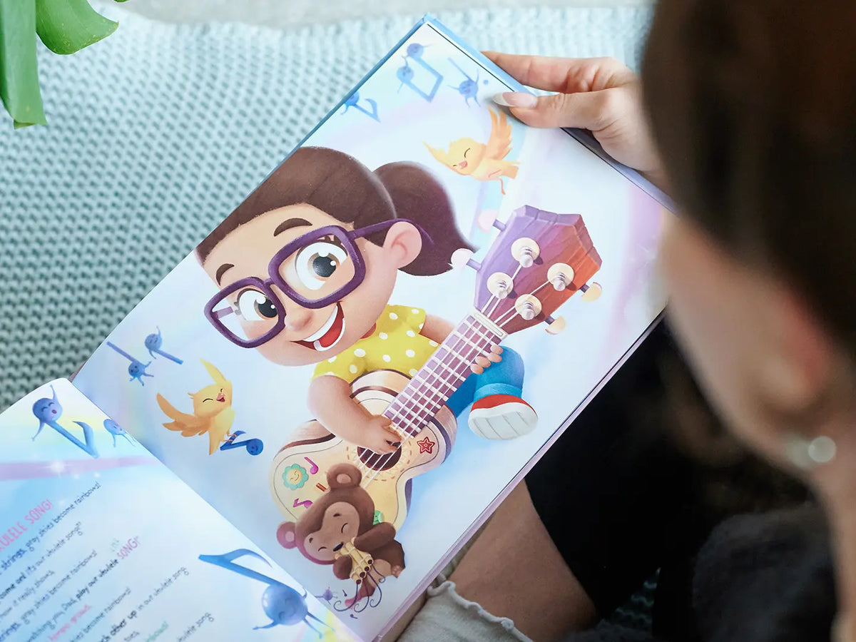 Lustige Illustration eines Mädchens, das Gitarre spielt, aus unserem maßgeschneiderten Vaterbuch für Weihnachten.